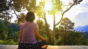 meditating outdoors is a healthy practice